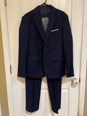 4 pc small navy blue suit includes jacket, pants, vest and tie. NWOT